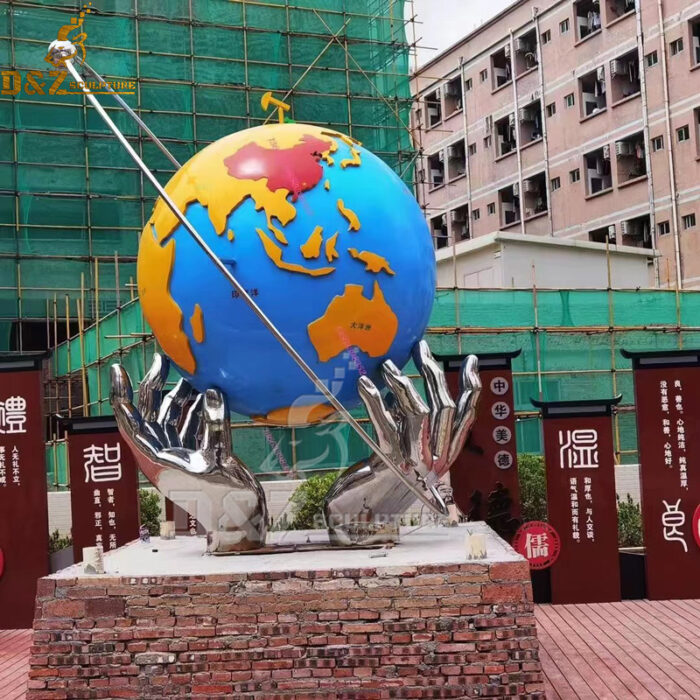 metal globe garden sculpture with hand sculpture for sale DZM1111