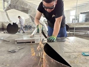 cuting the stainless steel sculpture