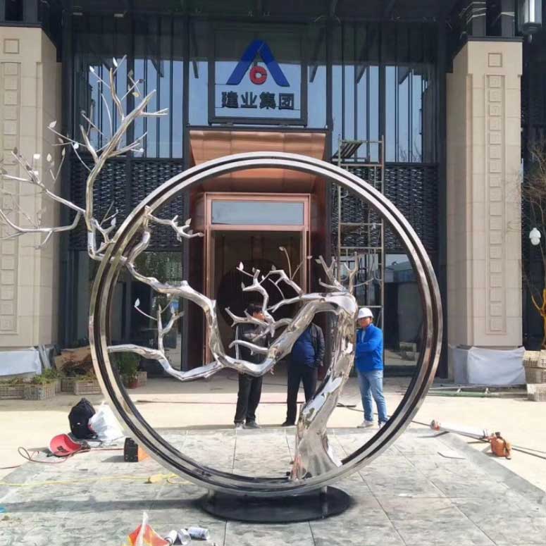 metal tree sculpture outdoor with circle