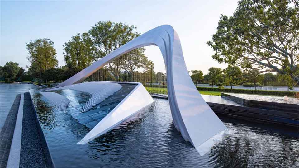 Large modern art-style metal rain-screen outdoor fountain sculpture for hotel entrance