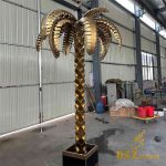 Outdoor golden metal palm tree sculptures: decor for large events and weddings