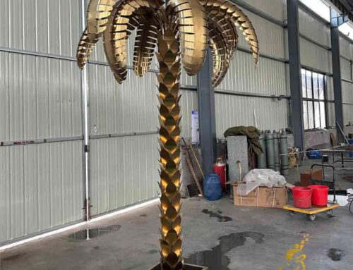 Outdoor golden metal palm tree sculptures: decor for large events and weddings