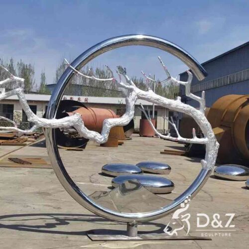 Modern large stainless steel circle and white dead tree sculpture for garden